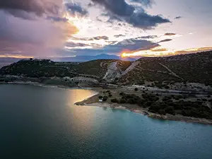 Epic Prints: Drone aerial view of Lake Polyfyto and mountain landscape at sunset