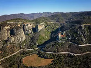 Cliffside Prints: Drone aerial view of Meteora with ancient holy Monastery of Varlaam and Great Meteoron