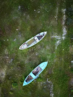 Watercraft Prints: Drone view of abandoned boats in Marmara dry lake with vegetation during sunset in Turkey