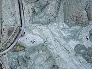 Vehicles Prints: Drone view of camper vans with solar panels in a dry mountain area in Turkey
