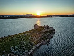 Drone Prints: Drone view captures Kizlar monastery on an island during sunset in Turkey