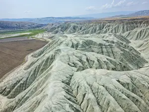 Range Prints: Drone view of grey mountains on dry landscape in Turkey showcasing unique geographical features around Ankara