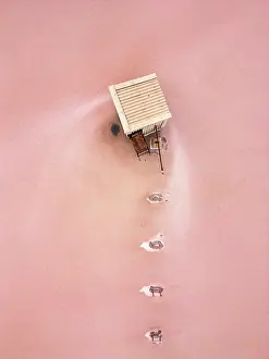 Flats Prints: Drone view of a house surrounded by pink salt in Tuz salt lake in Ankara Turkey
