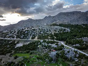Adventures Prints: Drone view shows ancient city ruins and mountains during sunset in Turkey