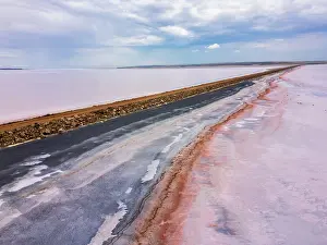 Flats Prints: Drone view shows Tuz salt lake road with unique pink and black salt colors in Turkey