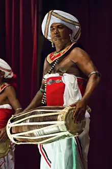 One Man Only Prints: Drummer in a Pancha Thuryas Kandyan dance orchestra at tourist show in the Kandyan Arts Association Hall