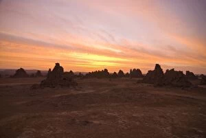The dry, bare rock formations of Lac Abbe at sunset, Djibouti, Africa