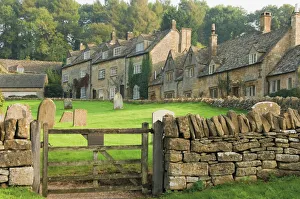 Dry stone wall, gate and stone cottages, Snowshill village, The Cotswolds Dry stone wall, gate and stone cottages, Snowshill village, The Cotswolds