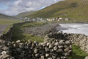 Dry stone walls and village of Husavik, Sandoy, Faroe Islands (Faroes), Denmark, Europe