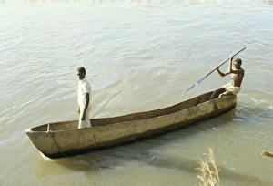 Tee Nager Prints: Dug out canoe on the River Nile at Mongala