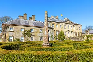 Landscaping Prints: Dumfries House Mahtouz garden features an obelisk with a clear blue sky in East Ayrshire Scotland