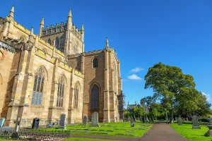 Cemetery Prints: Dunfermline Abbey stands tall against a blue sky in Dunfermline