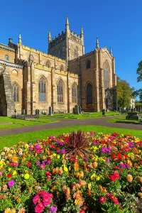 Floral Prints: Dunfermline Abbey surrounded by flowers in sunny weather during a clear day in Fife