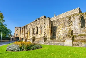 United Prints: Dunfermline Palace and Abbey remains show Refectory and Gatehouse in Scotland on a clear day