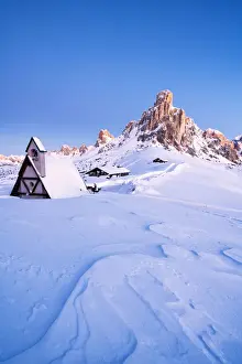 Chalet Prints: Dusk on the alpine chalet covered with snow with Ra Gusela in background, Giau Pass