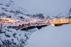 Nusfjord Prints: Dusk lights on the fishing village surrounded by snowy peaks, Nusfjord, Nordland