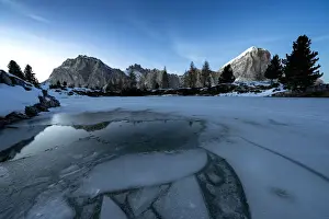 Coniferous Tree Prints: Dusk lights over the frozen lake Limides with Lagazuoi and Tofana di Rozes on background