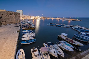Gallipoli Prints: Dusk lights the harbor and the medieval old town of Gallipoli, Province of Lecce