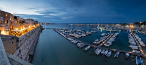 Province Of Lecce Prints: Dusk lights the harbor and the medieval old town of Otranto, Province of Lecce, Apulia