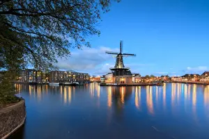 The Netherlands Prints: Dusk lights on the Windmill De Adriaan reflected in the River Spaarne