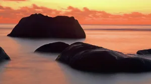 Retreat Prints: Dusk over rocks at Beau Vallon beach on Mahe island in Seychelles during sunset