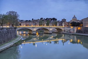 Dusk on Tiber River with Umberto I Bridge and the Basilica di San Pietro in the Vatican Dusk on Tiber River with Umberto I Bridge and the Basilica di San Pietro in the Vatican