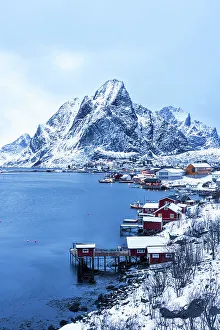 Cabin Prints: Dusk over the traditional fishing village of Reine after snowfall