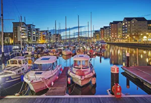 Apartment Building Prints: A dusk view of the modernised harbour and marina at Portishead, near Bristol, in Somerset