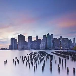 Wooden Post Prints: Dusk view of the skyscrapers of Manhattan from the Brooklyn Heights neighborhood