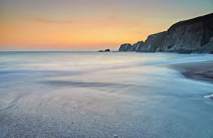 Kingsbridge Prints: A dusk view of surf surging ashore at Ayrmer Cove