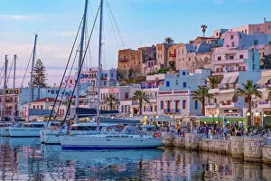 Dusk with yachts moored at the harbour waterfront in Naxos Town, Naxos, the Cyclades, Aegean Sea, Greek Islands, Greece