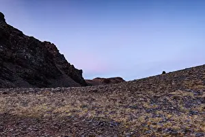 Barren Prints: Dusky light casts shadows over rocky slopes of Cerro del Caballo in Sierra Nevada