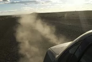 Dust kicks up from behind of car in Patagonia, on the infamous Route 40