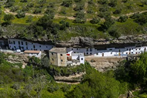 Dwellings built into rock overhangs above the Rio Guadalporcun, Setenil de las Bodegas, Andalucia, Spain, Europe