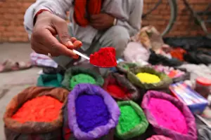 Stall Prints: A dye trader offers his brightly coloured wares in a roadside stall in Kathmandu
