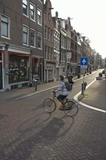 Early morning commuter on a bicycle, Amsterdam, Netherlands, Europe