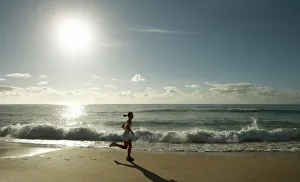 Fitness Prints: Early morning female runner, Bondi beach, Sydney, New South Wales, Australia, Pacific