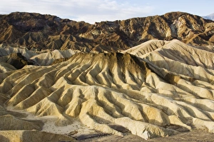 Early morning light on corrugated badlands landscape
