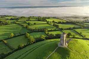 Glastonbury Prints: Early morning mists at St. Michaels Tower on Glastonbury Tor in Somerset