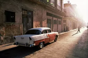 Cuba Gallery: Early morning street scene with classic American car, Havana, Cuba, West Indies