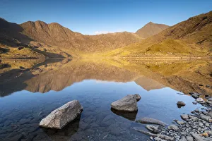 Early morning sunlight on Snowdon in spring, reflected in Llyn Llydaw