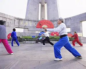 Chinese Ethnicity Prints: Early morning t ai chi exercises in Huangpu Park on the Bund, Shanghai, China, Asia
