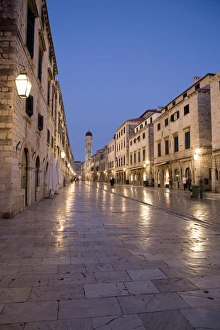 Early morning view along Stradun Street, tower of the Church of St. Saviour