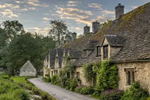 Homes Prints: Early Spring morning view of the beautiful Cotswolds cottages at Arlington Row in Bibury