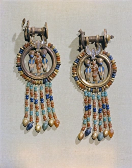 Treasure Prints: Earrings which show the king flanked by two sacred serpents in the centre of the clip