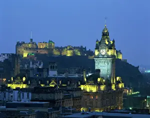 Hotels Prints: Edinburgh Castle and the Waverley Hotel clock tower illuminated at dusk