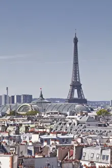Urban Sprawl Prints: The Eiffel Tower rising over the rooftops of Paris, France, Europe