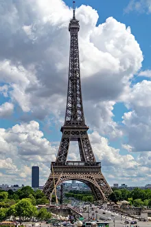 Eiffel Tower on a sunny day with blue sky and fluffy clouds, iconic Parisian landmark, Paris, France, Europe