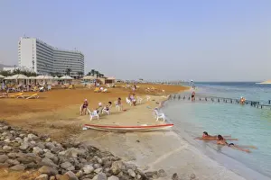 Ein Bokek (En Boqeq) beach, with bathers in the turquoise sea and relaxing ashore