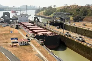Panama Prints: Electric mules guiding Panamax ship through Miraflores Locks on the Panama Canal